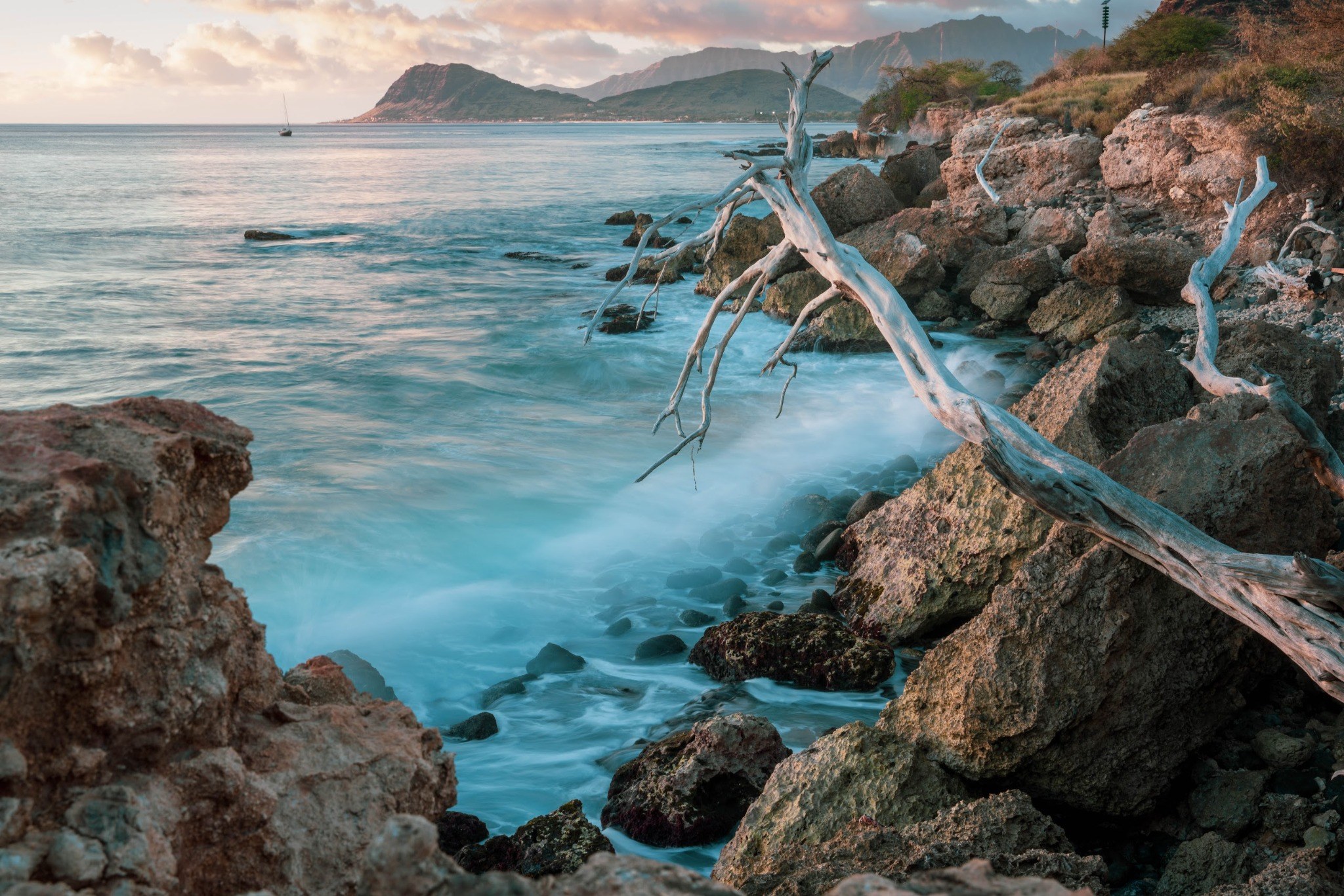 Ocean landscape with textured rocks and clouds